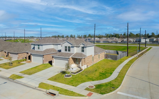 view of front of house featuring a front yard and a garage