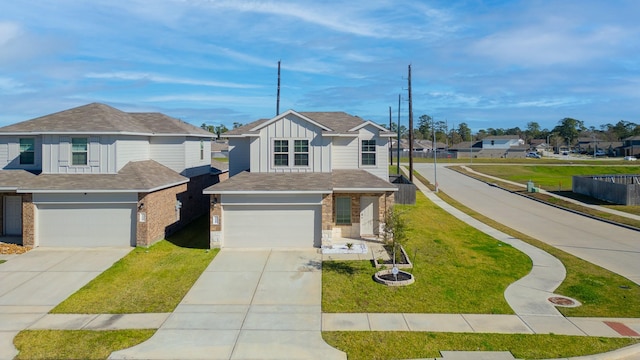 view of front of house featuring a garage and a front yard