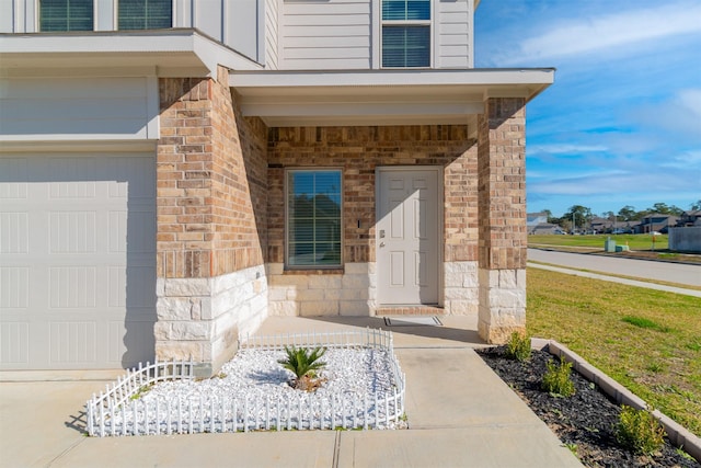 view of exterior entry featuring a garage