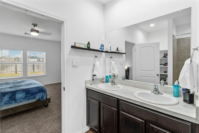 bathroom featuring ceiling fan and vanity