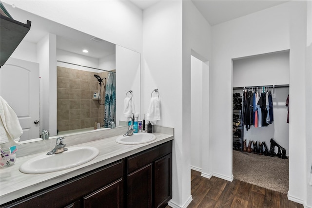 bathroom featuring hardwood / wood-style floors, vanity, and a shower with curtain