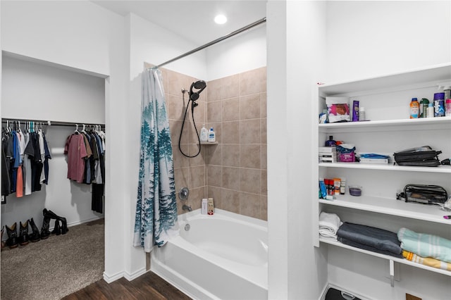 bathroom featuring shower / bathtub combination with curtain and wood-type flooring