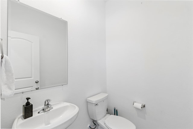 bathroom with toilet and sink