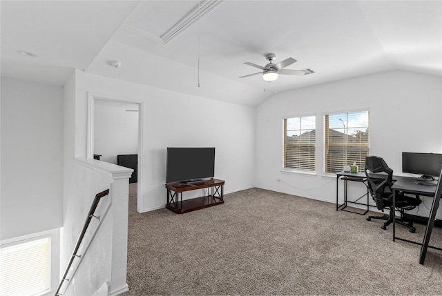 carpeted home office with ceiling fan and lofted ceiling