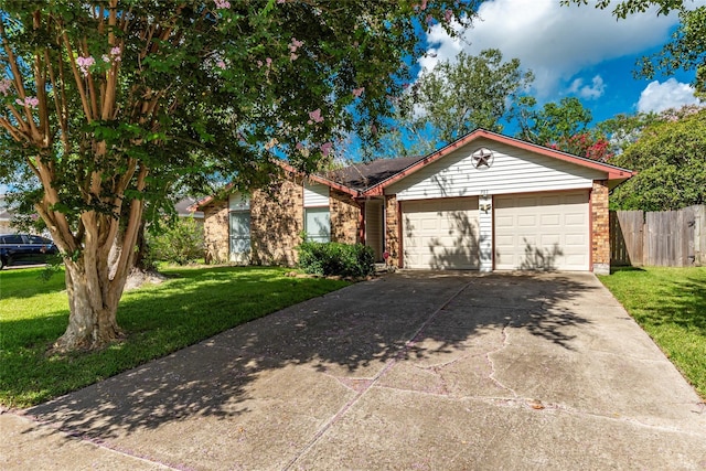 ranch-style house featuring a front yard and a garage