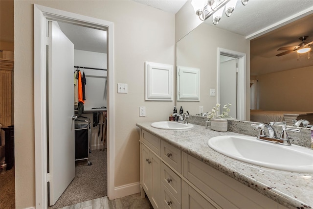 bathroom with vanity and ceiling fan