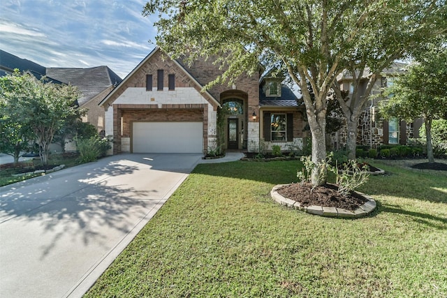 view of front of property with a front yard and a garage