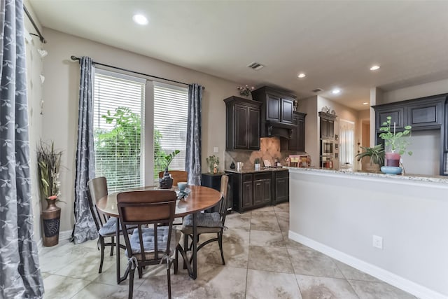 dining space with light tile patterned floors