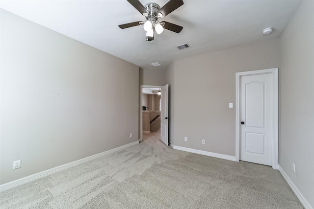 unfurnished bedroom featuring light colored carpet and ceiling fan