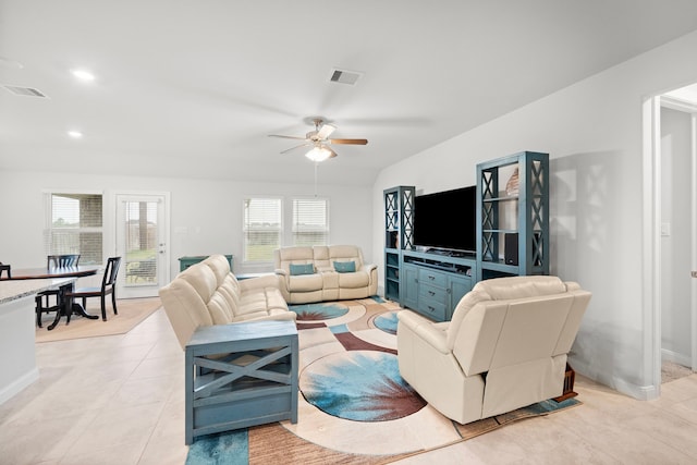 living room with ceiling fan and light tile patterned floors