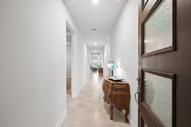 corridor with light tile patterned flooring