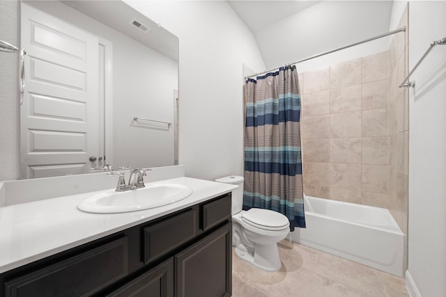 full bathroom featuring vanity, vaulted ceiling, shower / bathtub combination with curtain, tile patterned flooring, and toilet