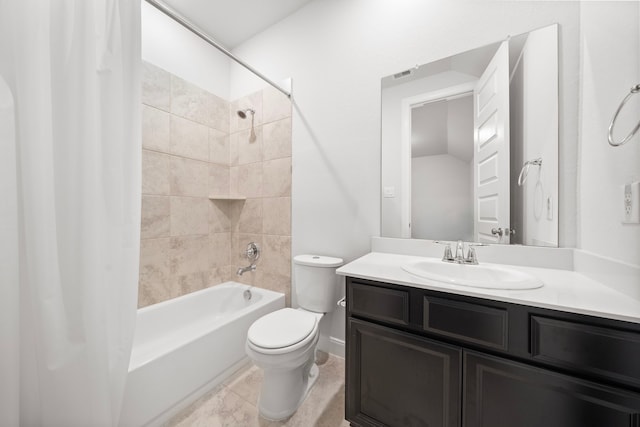 full bathroom featuring tiled shower / bath combo, toilet, and vanity