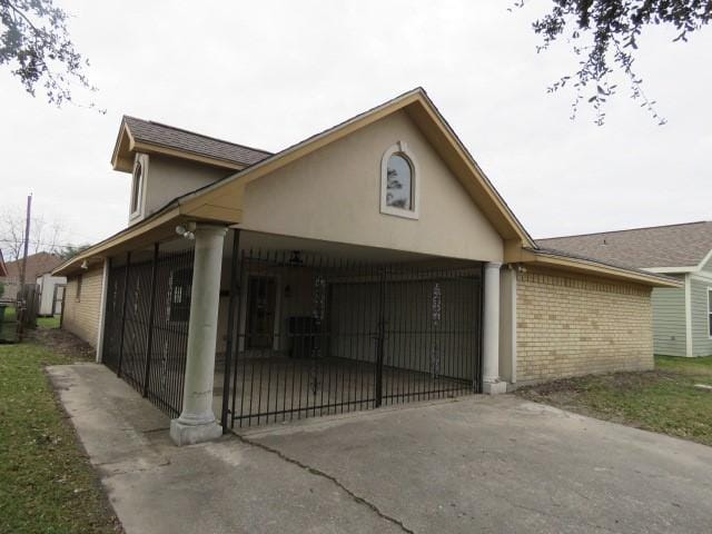 view of home's exterior featuring a carport