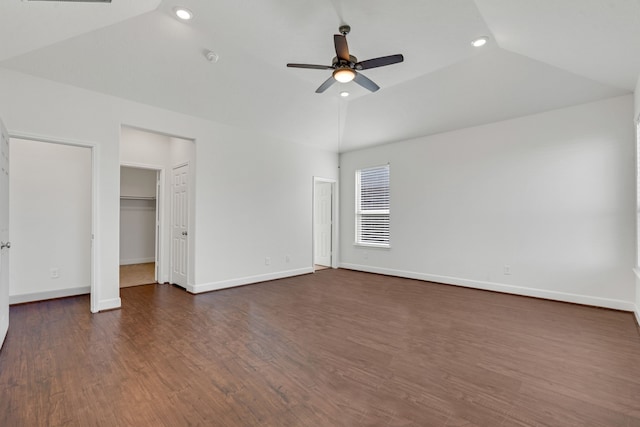 unfurnished bedroom featuring ceiling fan, dark hardwood / wood-style flooring, and lofted ceiling