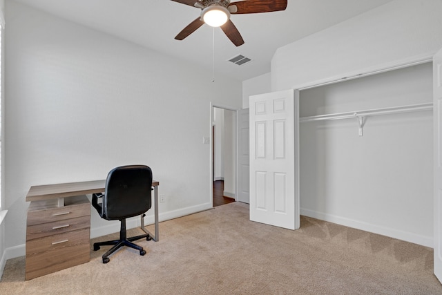 office space featuring ceiling fan and light carpet