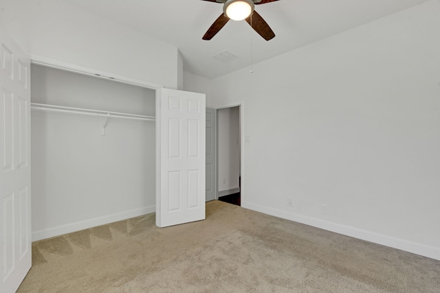 unfurnished bedroom with carpet flooring, a closet, and ceiling fan