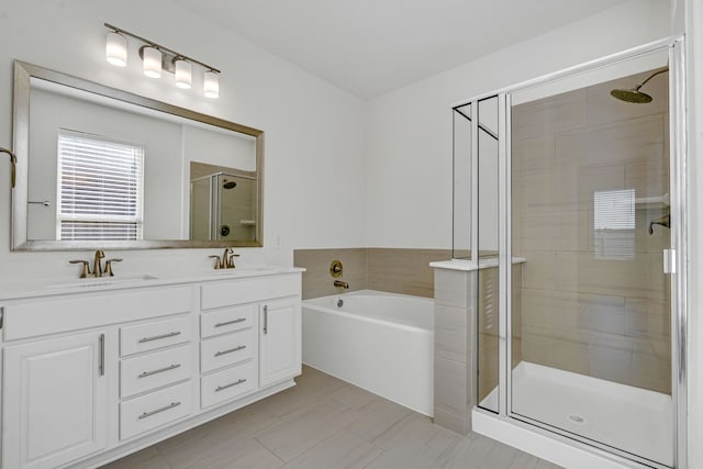 bathroom featuring tile patterned flooring, vanity, and plus walk in shower