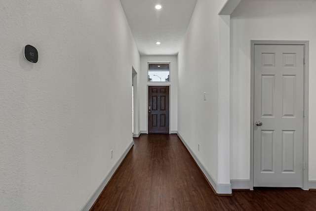 hallway featuring dark hardwood / wood-style flooring