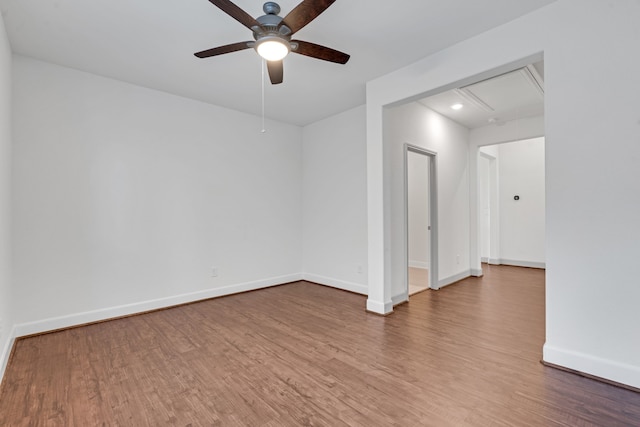 spare room featuring hardwood / wood-style flooring and ceiling fan