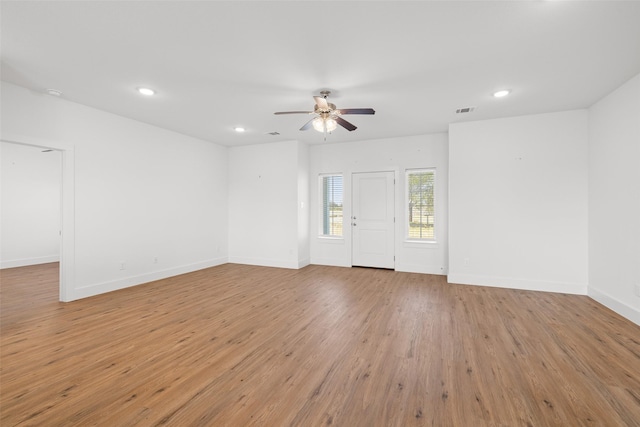 unfurnished room featuring light hardwood / wood-style floors and ceiling fan