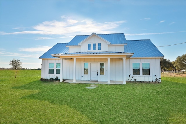 back of house with a yard