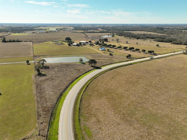 bird's eye view featuring a rural view and a water view