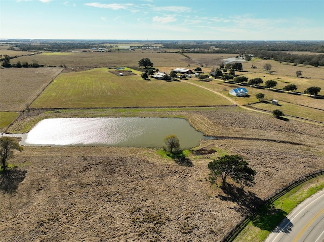 drone / aerial view featuring a water view and a rural view