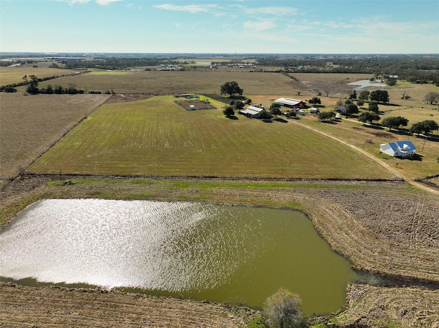 birds eye view of property with a rural view and a water view