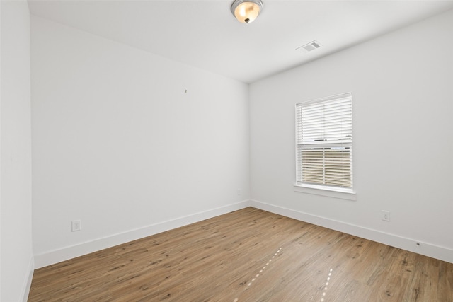 empty room with wood-type flooring