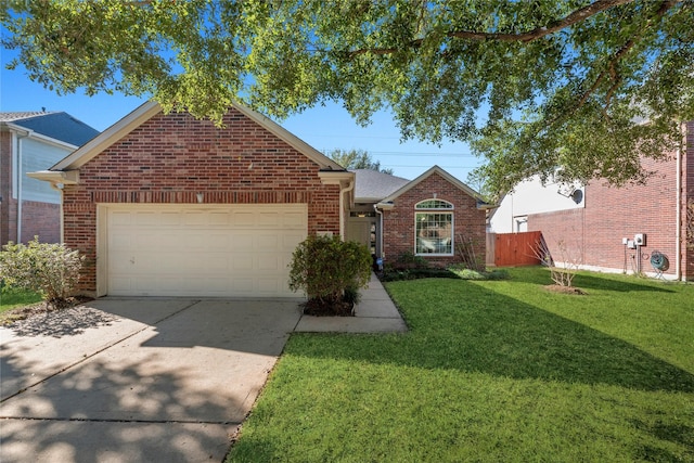 view of front of home with a garage and a front lawn