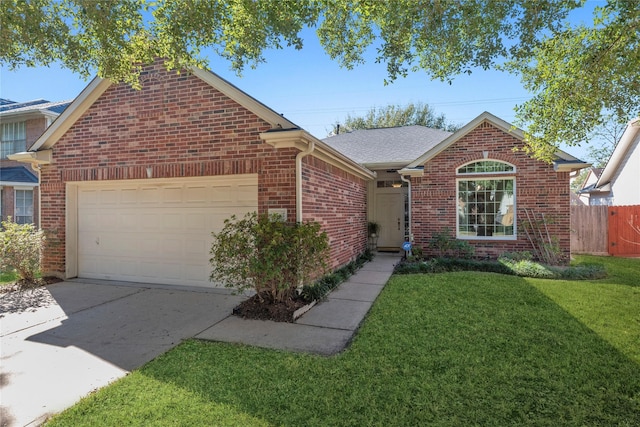 view of front of property featuring a garage and a front lawn