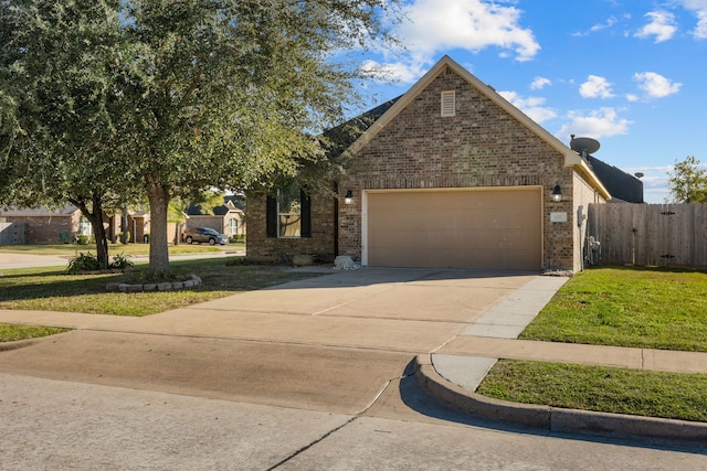 view of front facade featuring a garage and a front yard