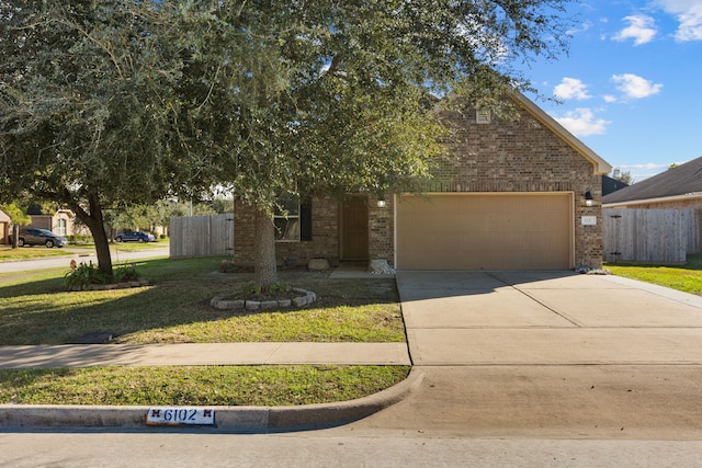 view of front facade with a garage and a front yard