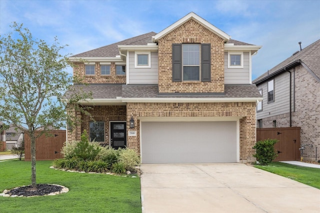 view of front facade with a garage and a front lawn