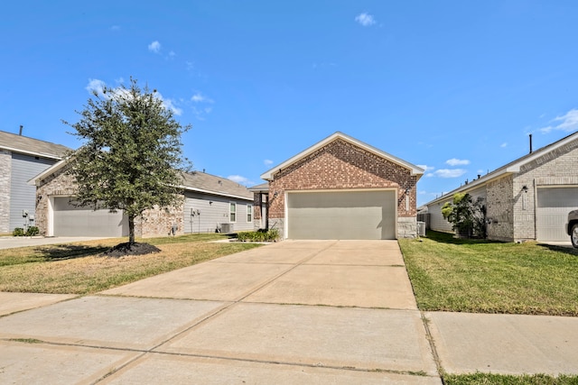 view of front of home featuring a garage and a front lawn