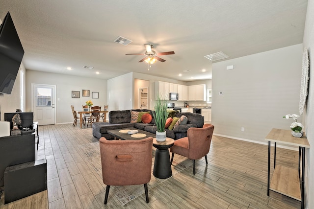 living room featuring ceiling fan