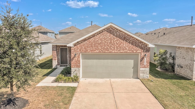 view of front of property featuring a front lawn and a garage