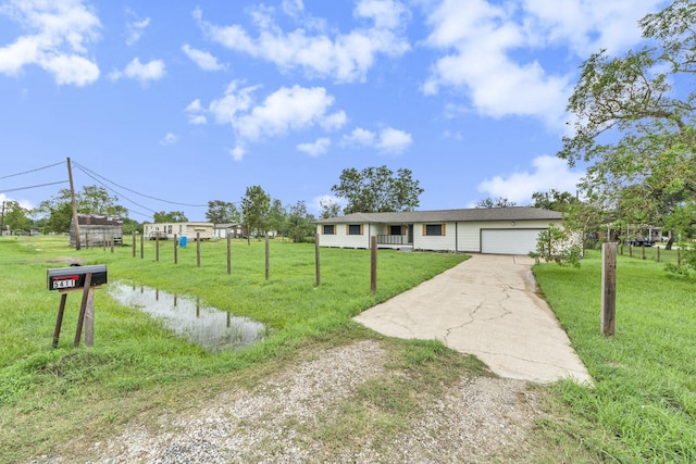 view of front of house with a front lawn and a garage