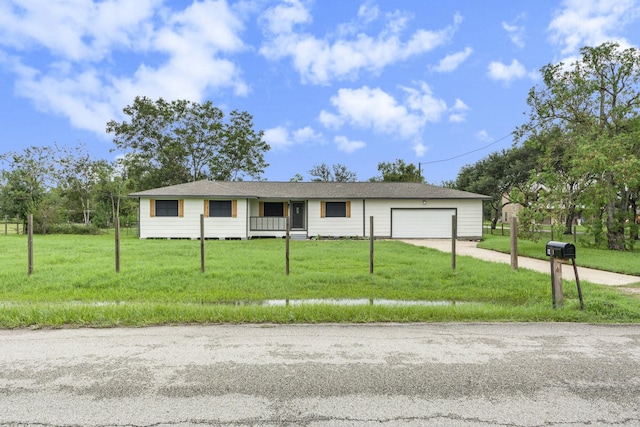 single story home with a garage and a front yard