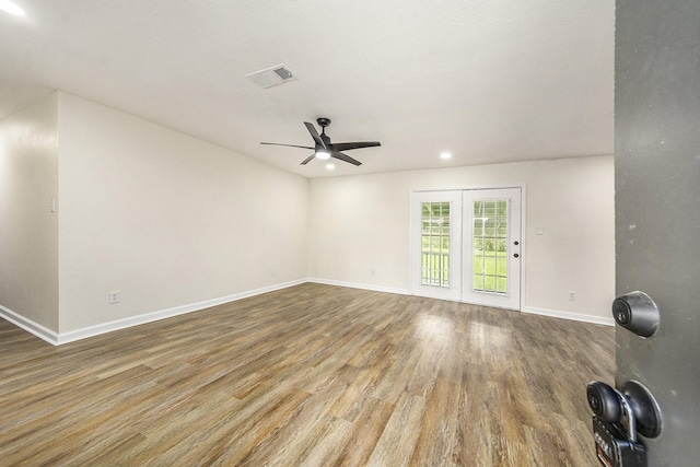 spare room featuring hardwood / wood-style flooring and ceiling fan