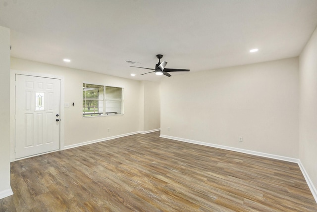 interior space with ceiling fan and wood-type flooring