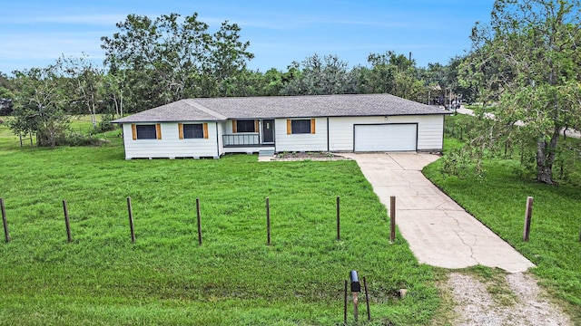 ranch-style house featuring a porch, a front yard, and a garage