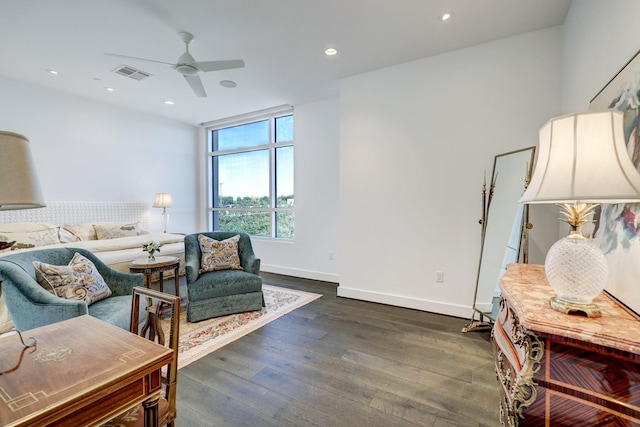 sitting room with ceiling fan and dark hardwood / wood-style floors