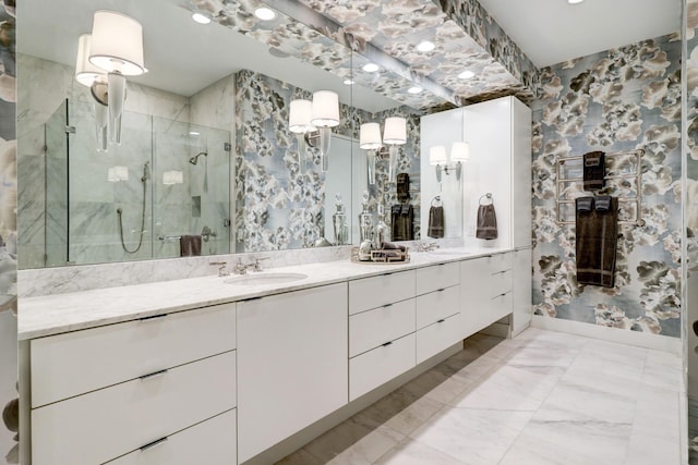 bathroom featuring vanity and a shower with door