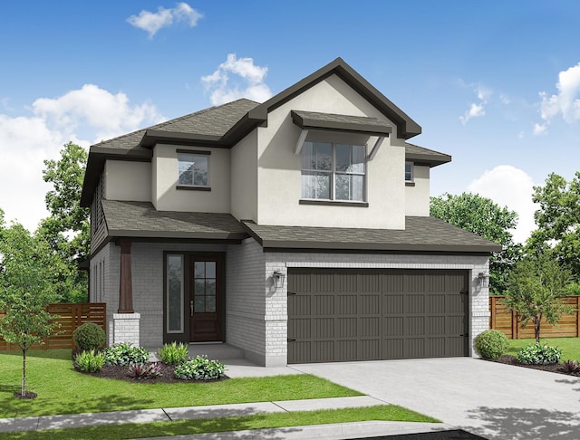 view of front of house featuring a garage and a front lawn