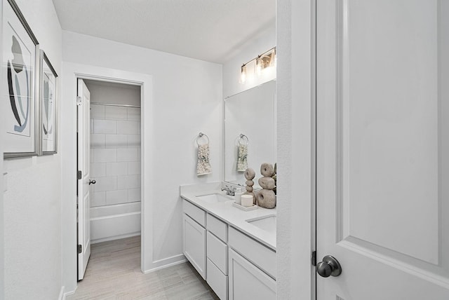 bathroom with vanity and shower / tub combination