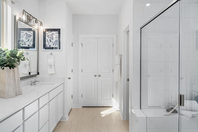 bathroom with vanity and an enclosed shower