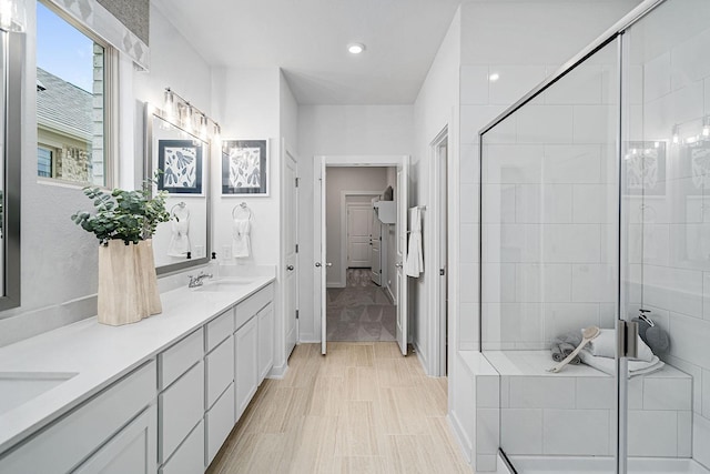 bathroom with vanity and walk in shower