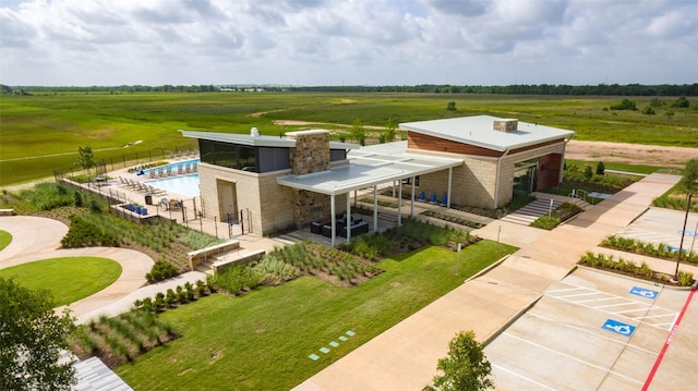 birds eye view of property with a rural view